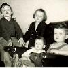 Four of us, with me as the baby, around 1950.