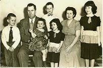 A professional picture taken of the 5 of us and our parents, around 1955.