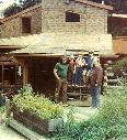 Ed and his family standing in front of their house.