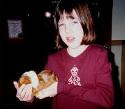 Serena holding Fluffy, the mom guinea pig.