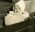 My mom, a few months old in a baby buggy.  Click for the whole picture.