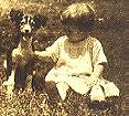 My mom very young with a pet dog.  Click for larger view.