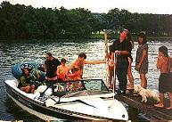 A party by the river, some of us riding in the boat.