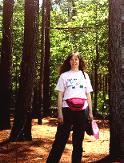 Me, standing in the woods near the tent area.