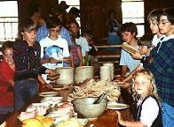 The kids helping themselves to food.