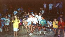 Families gathered at the outdoor theater for a talent show.