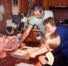 The family that hosted us before my last child was born, serving cake to the kids.