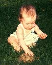 Anna as a baby with one of the turtles.