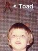 My son with a toad climbing the door behind him.