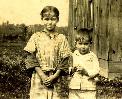 My dad with his sister, standing on their old farm.  Click for much larger view.